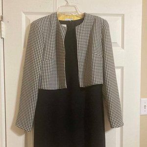 Sophisticated Fitted black shell sleeveless dress with hounds tooth jacket